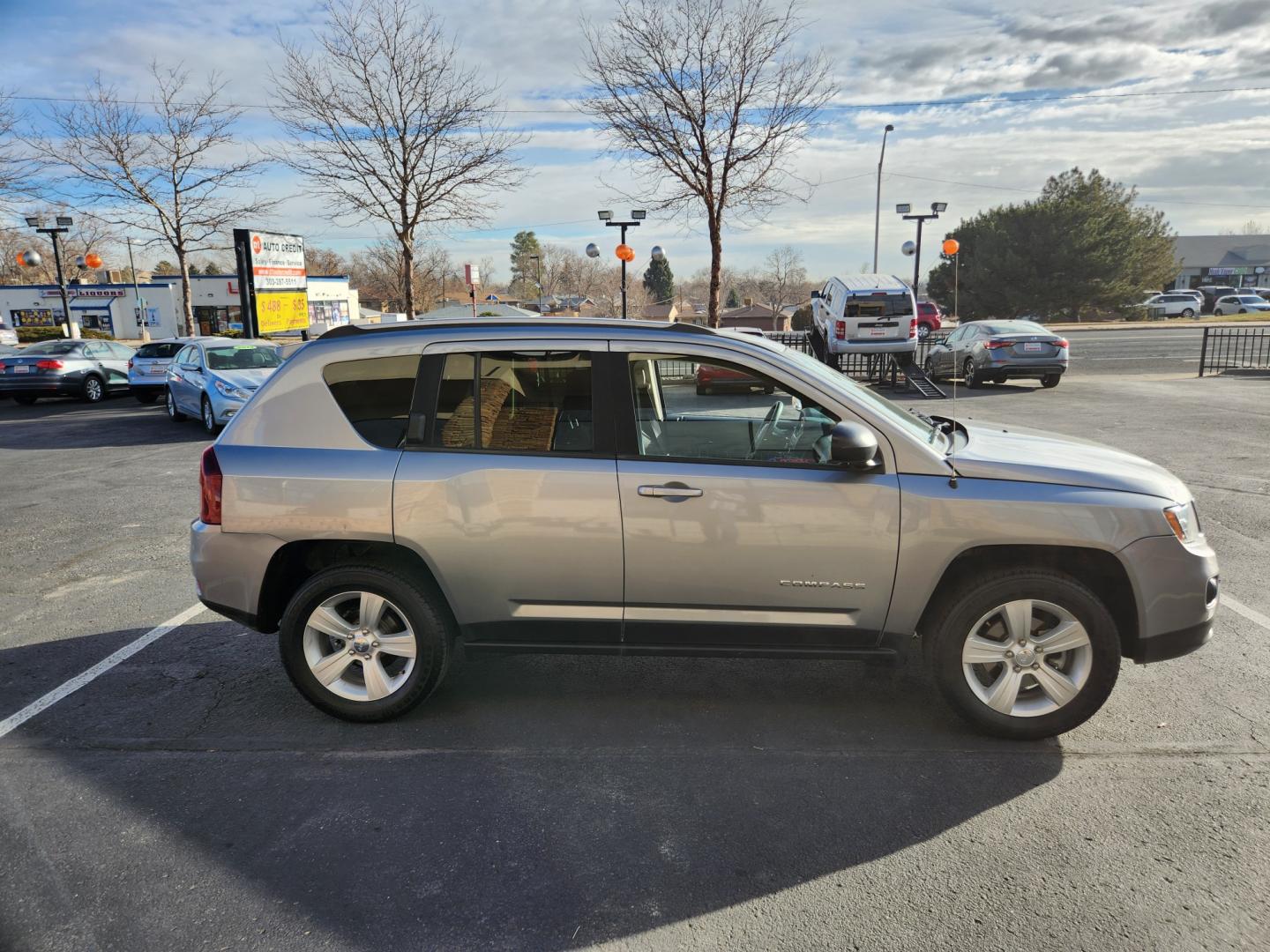 2015 Billet Silver Metallic Clearcoat /Dark Slate Gray Jeep Compass Sport (1C4NJDBB9FD) with an 2.4L I4 DOHC 16V Dual VVT engine, Automatic transmission, located at 10890 W. Colfax Ave., Lakewood, CO, 80215, (303) 274-7692, 39.739914, -105.120132 - 2015 Jeep Compass<br><br>D1 Auto NEVER charges dealer fees! All cars have clean titles and have been inspected for mechanical issues. We have financing for everyone. Good credit, bad credit, first time buyers.<br><br>Please call Lakewood Location 303-274-7692 or Thornton 303-287-5511 to schedule a t - Photo#4